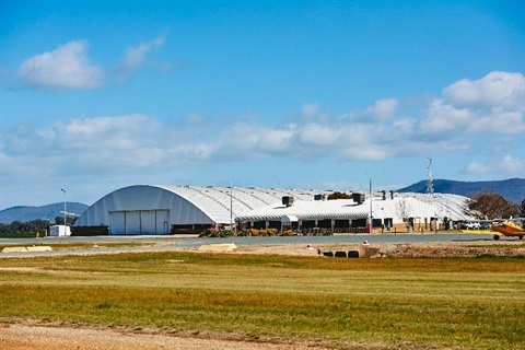Wangaratta Aerodrome airport summer grass white dome hangar blue sky white clouds 